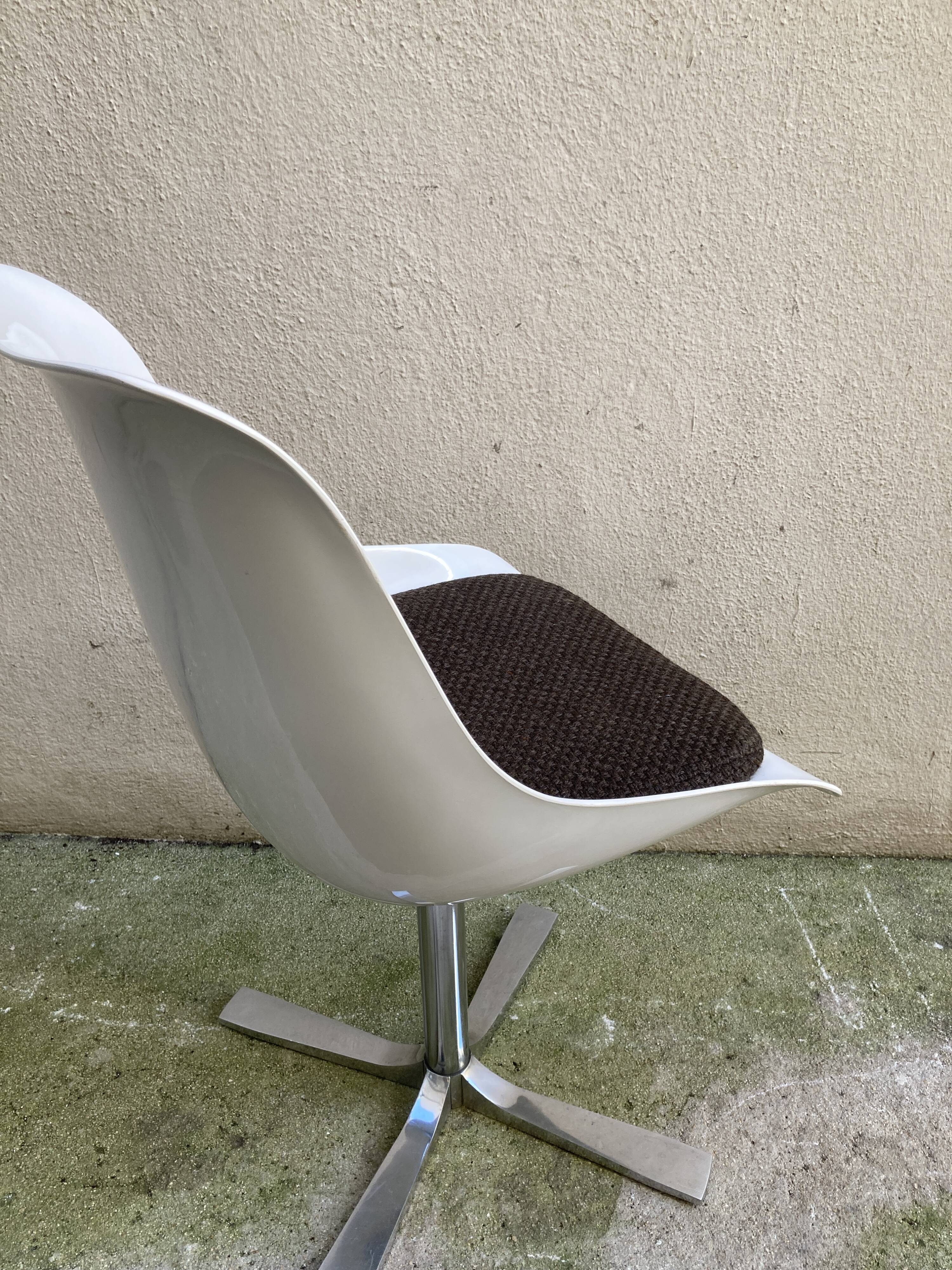 Roche Bobois tulip chair in moulded plastic with a chrome star base.