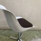Roche Bobois tulip chair in moulded plastic with a chrome star base.