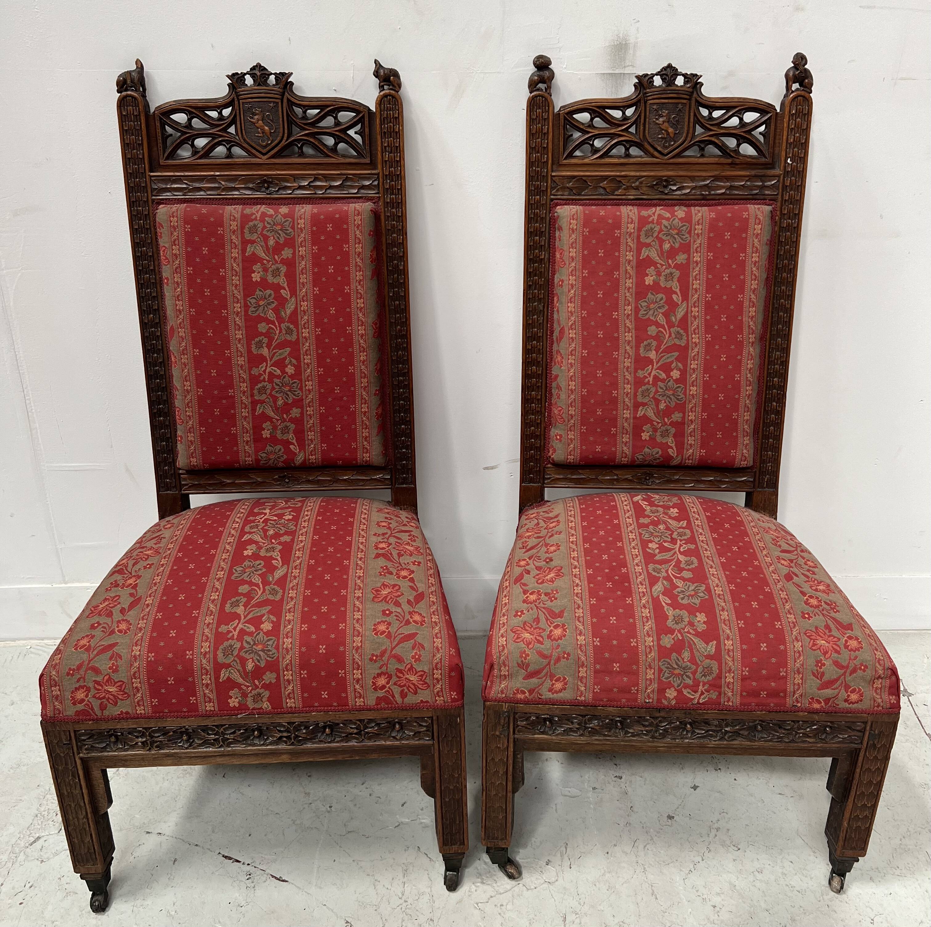 Pair of Gothic-style walnut lounge chairs, 19th century