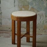 Mid-century Danish stool in oak, reupholstered in boucle wool, circa 1950.