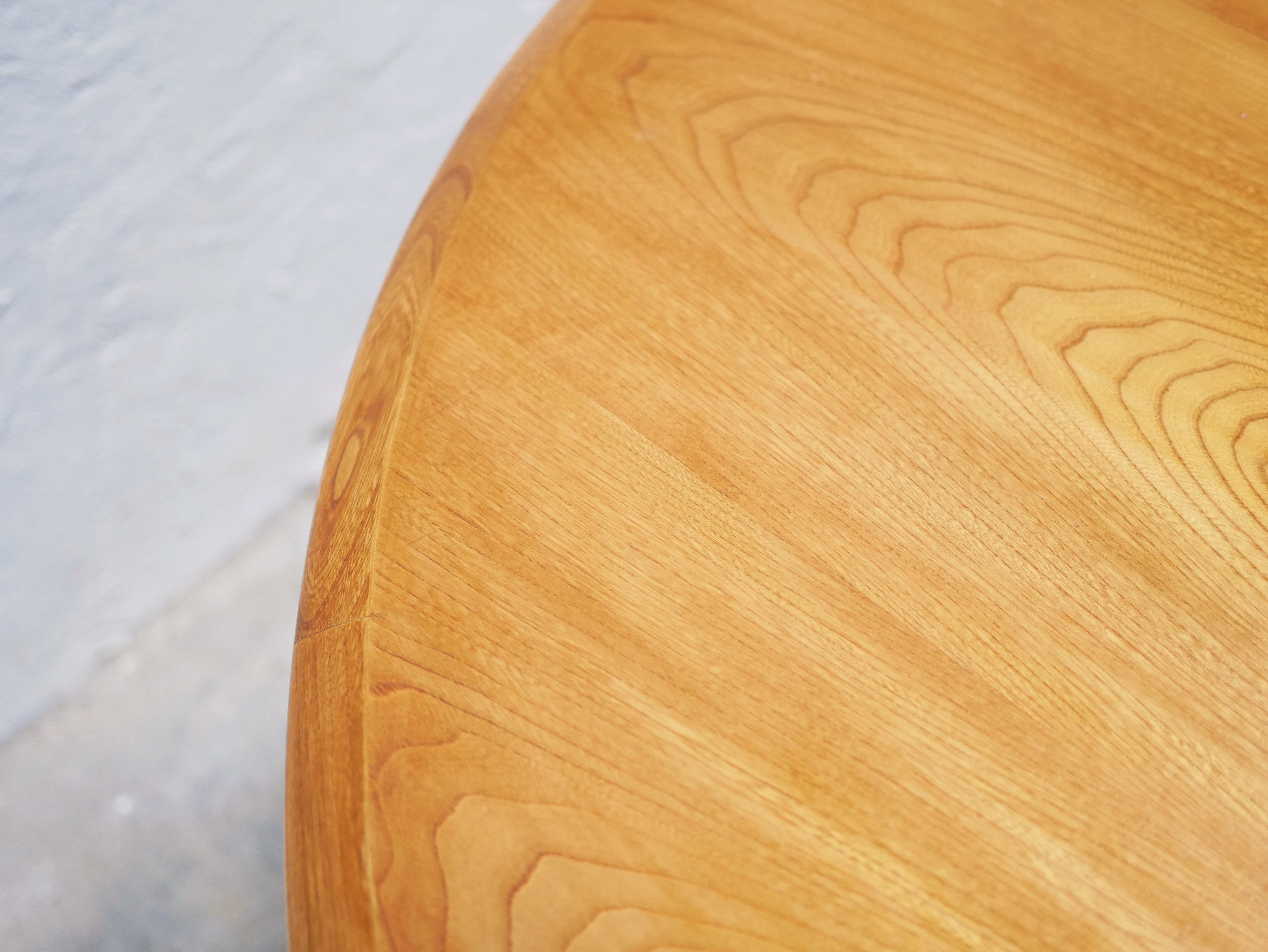 Vintage extendable round wooden dining table