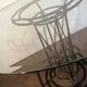 Wrought iron dining table with beveled round glass top, vintage 1980