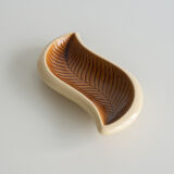 Beige and off-white ceramic ravier