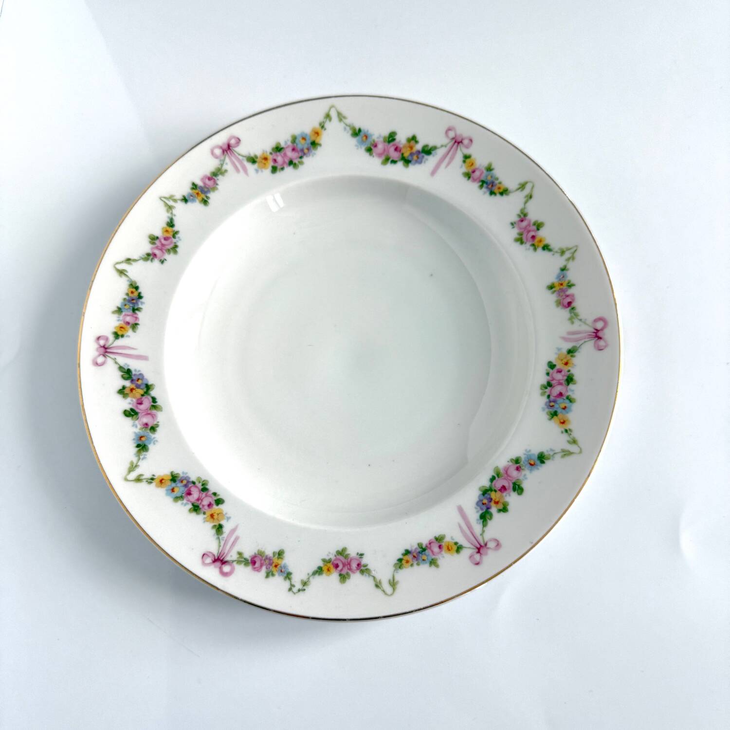 Pair of soup plates by EPIAG | ribbons/bows and garlands