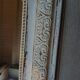 Antique mirror with carved wooden frame