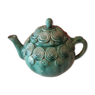 Green ceramic teapot