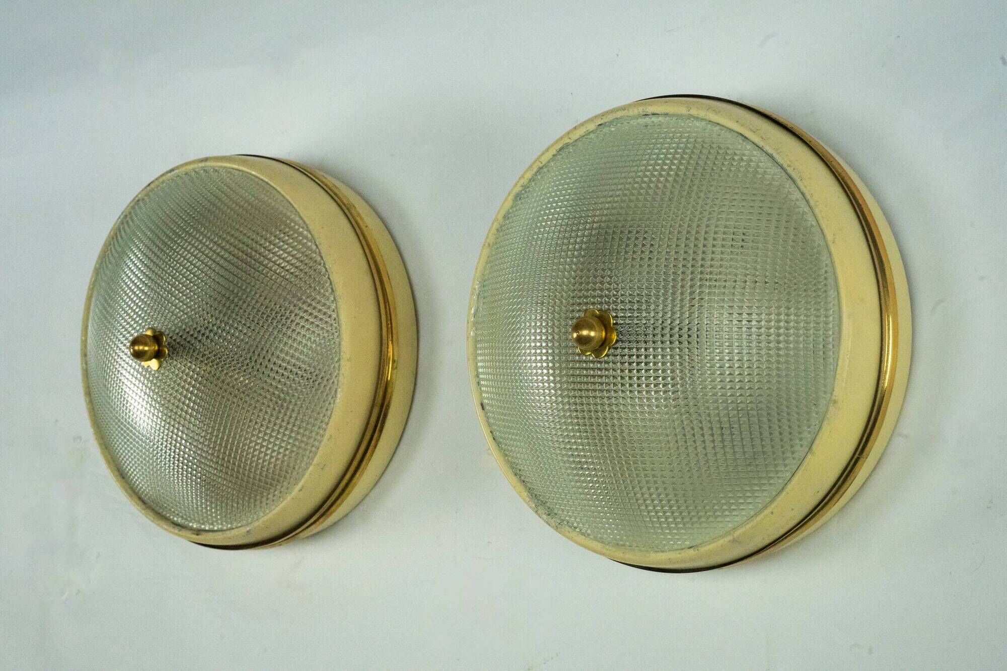 Lumi Milano, pair of wall or ceiling lamps in glass, brass and lacquer, 50s