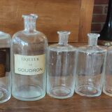 Series of 5 blown glass apothecary pharmacy bottles