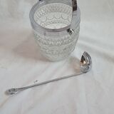 Ice bucket and spoon thereon