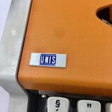 WE typewriter orange