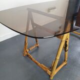 1970s dining table with bamboo trestle legs and smoked glass
