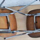 Pair of formica chairs with chrome metal backs in the shape of a lyre.