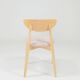 Set of 6 pale pink dining chairs in natural wood.