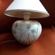 Antique ceramic lamp with floral decoration.