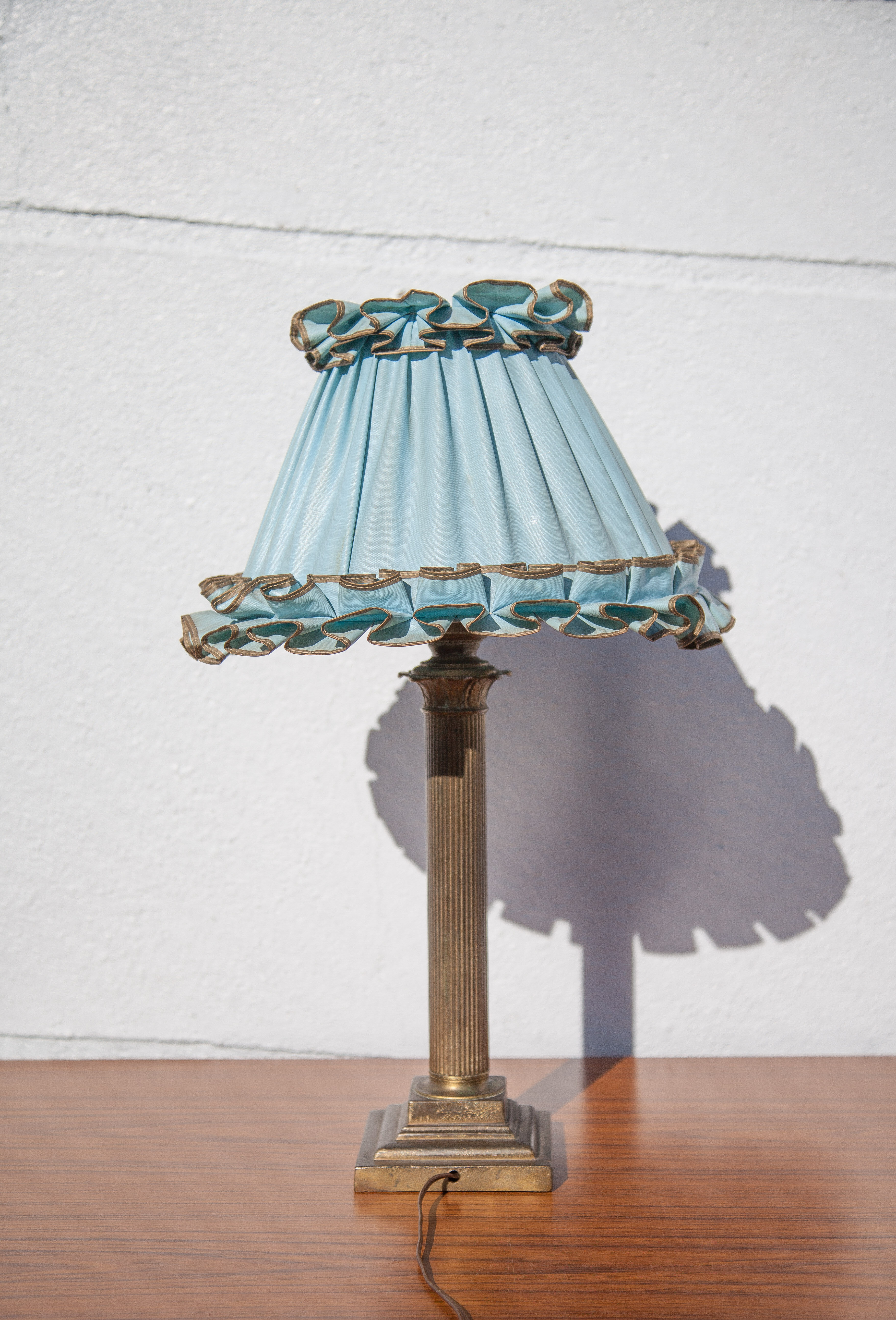 Brass lamp with vintage blue laminated lampshade