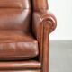 Large sheepskin wingback armchair in timeless English style