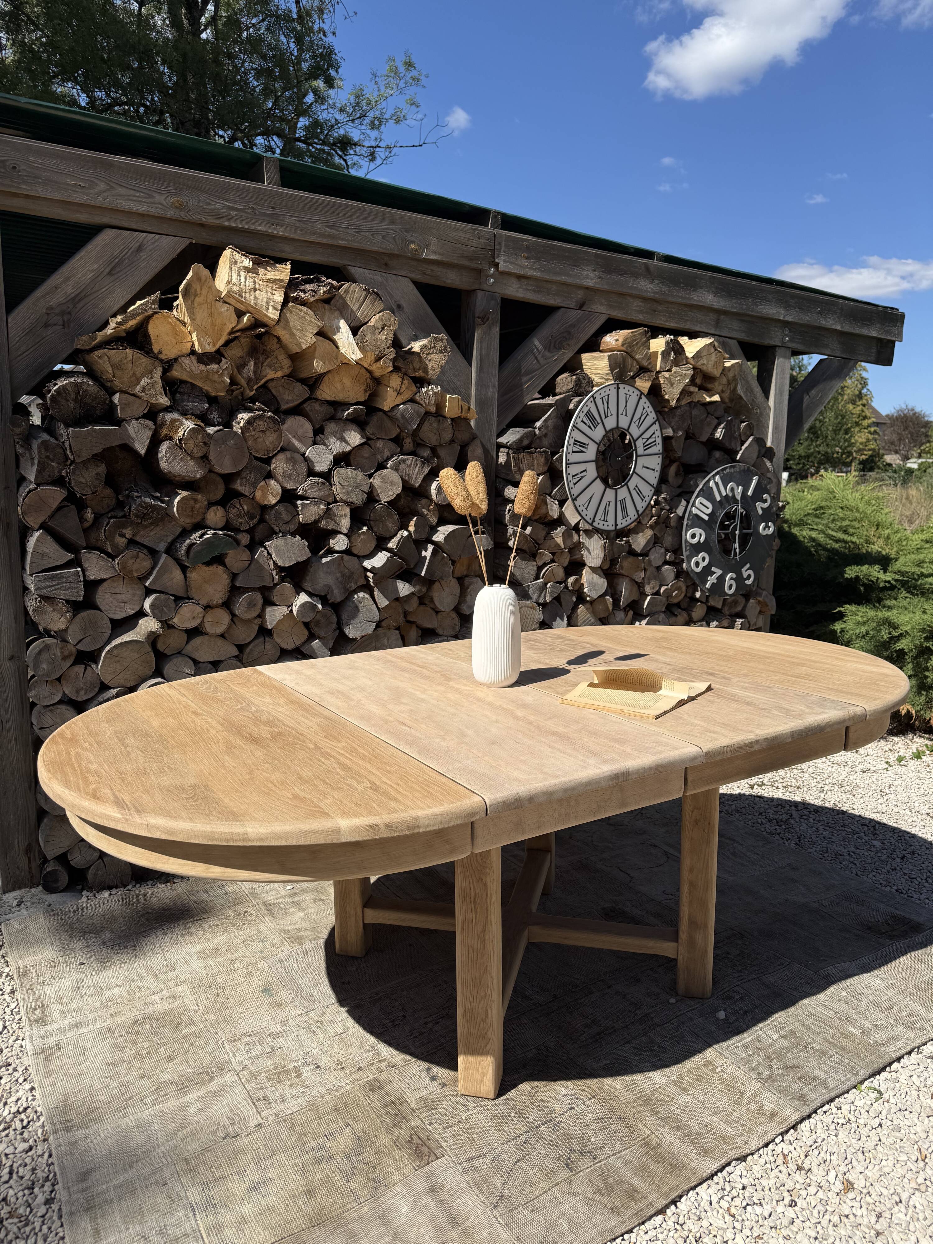 Round solid oak table with extensions, maximum 220cm.