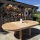 Round solid oak table with extensions, maximum 220cm.