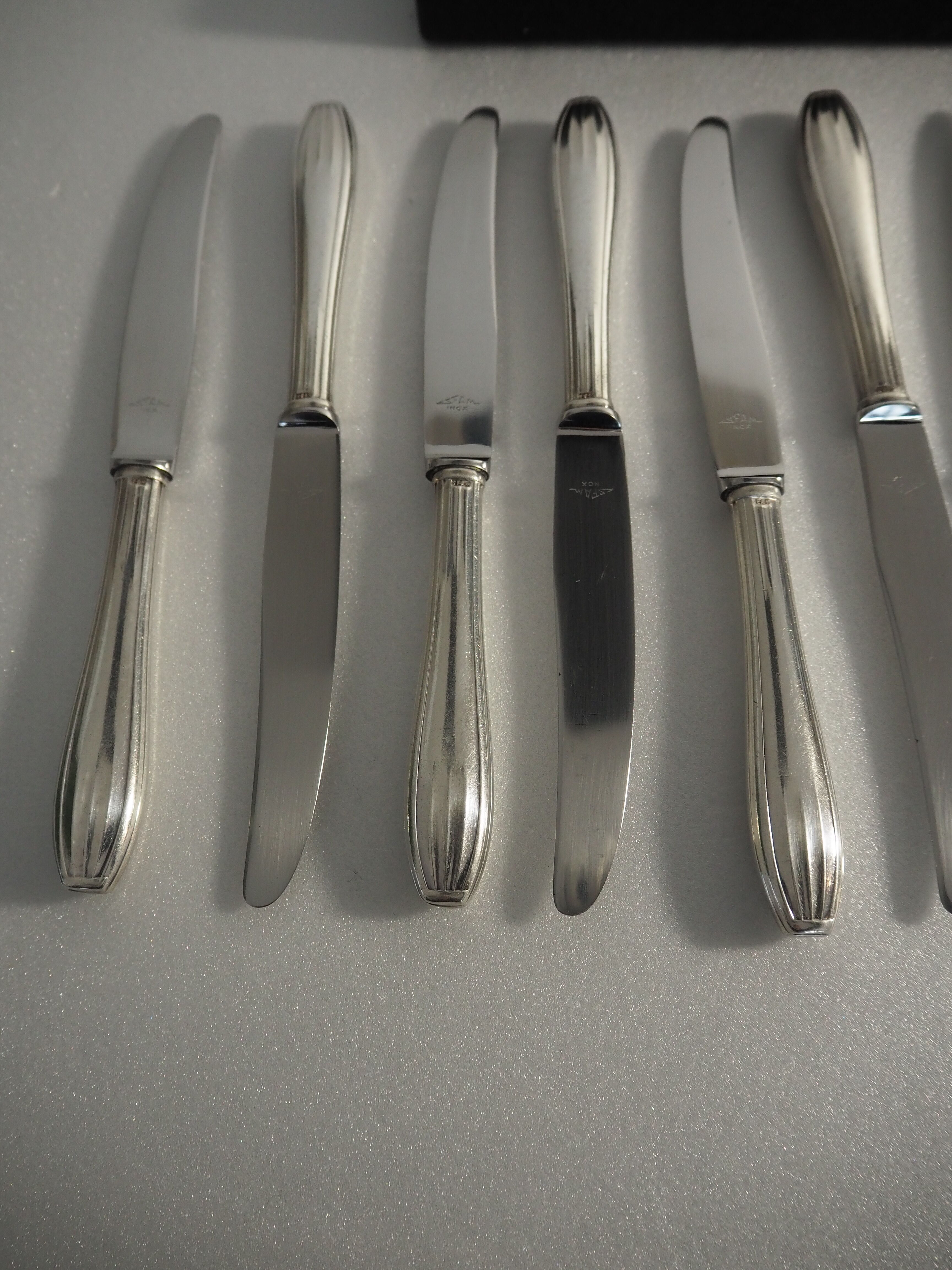 12 SFAM cheese knives in its dark chocolate case