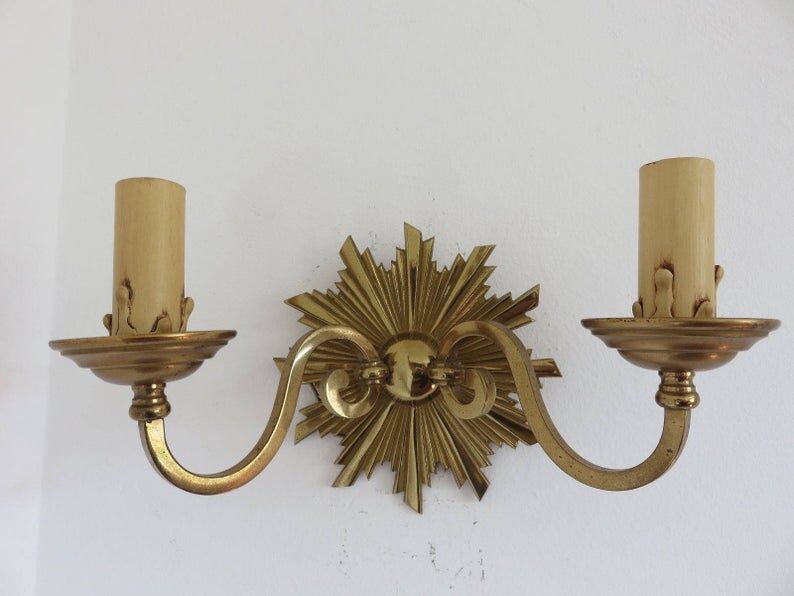 Wall lamp "little sun" in 70s golden brass