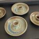 Series of 4 vintage stoneware candle holders