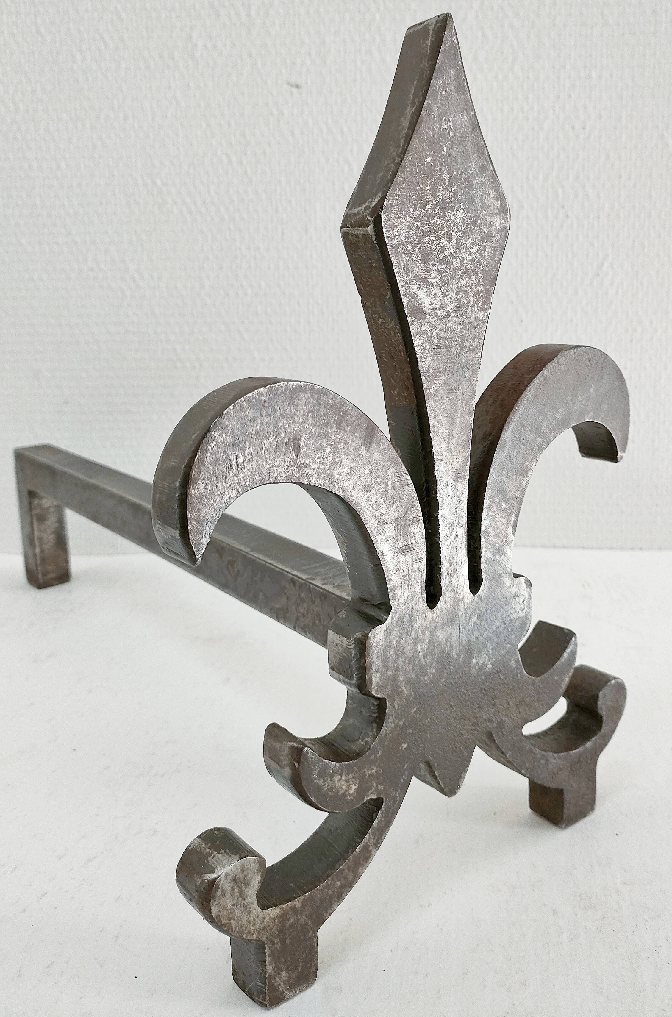 Pair of vintage steel fleur-de-lys andirons