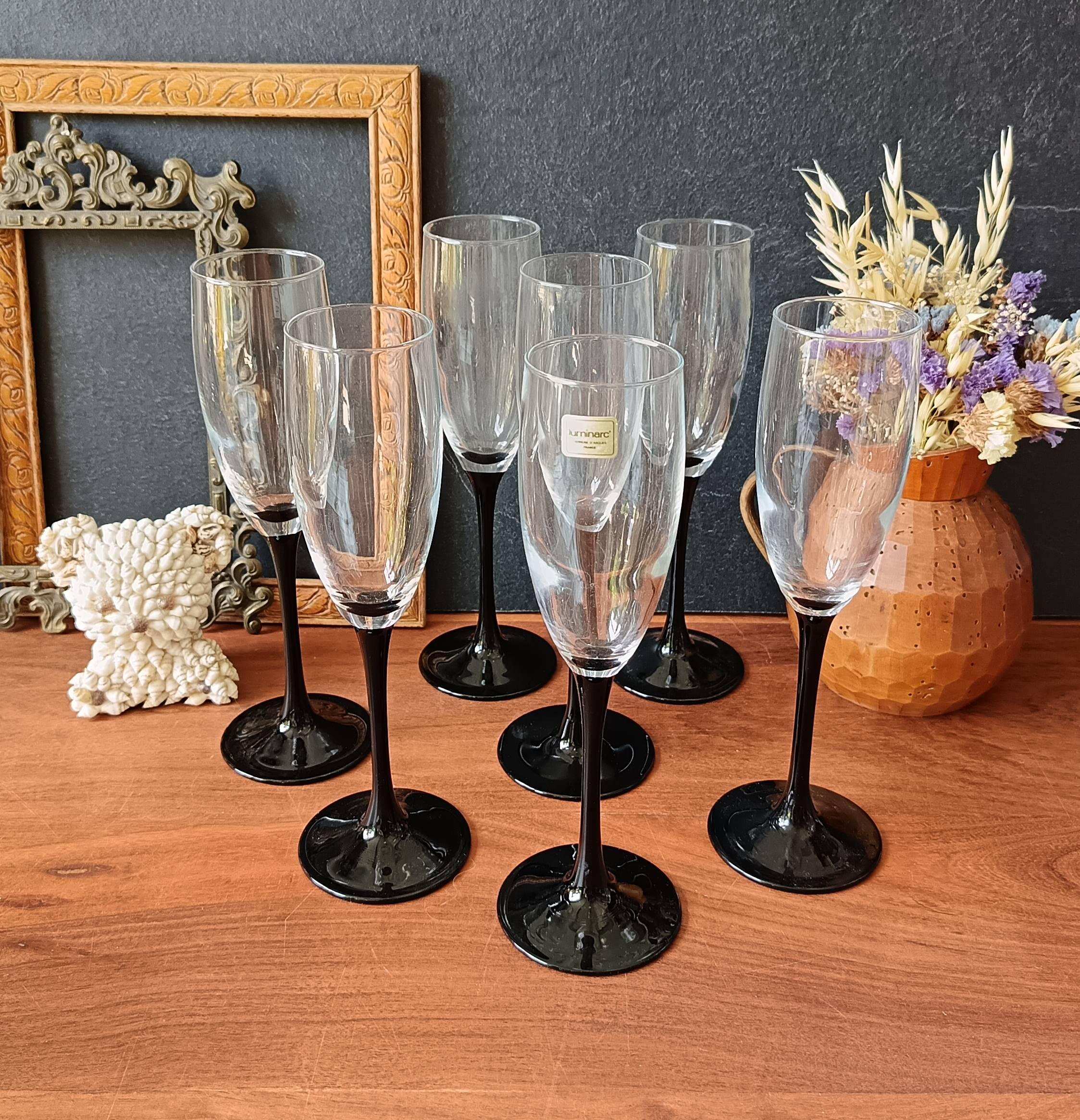 7 Luminarc Domino flutes, black opal tempered vintage glass.