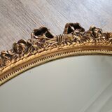 Ancien miroir ovale avec cadre doré