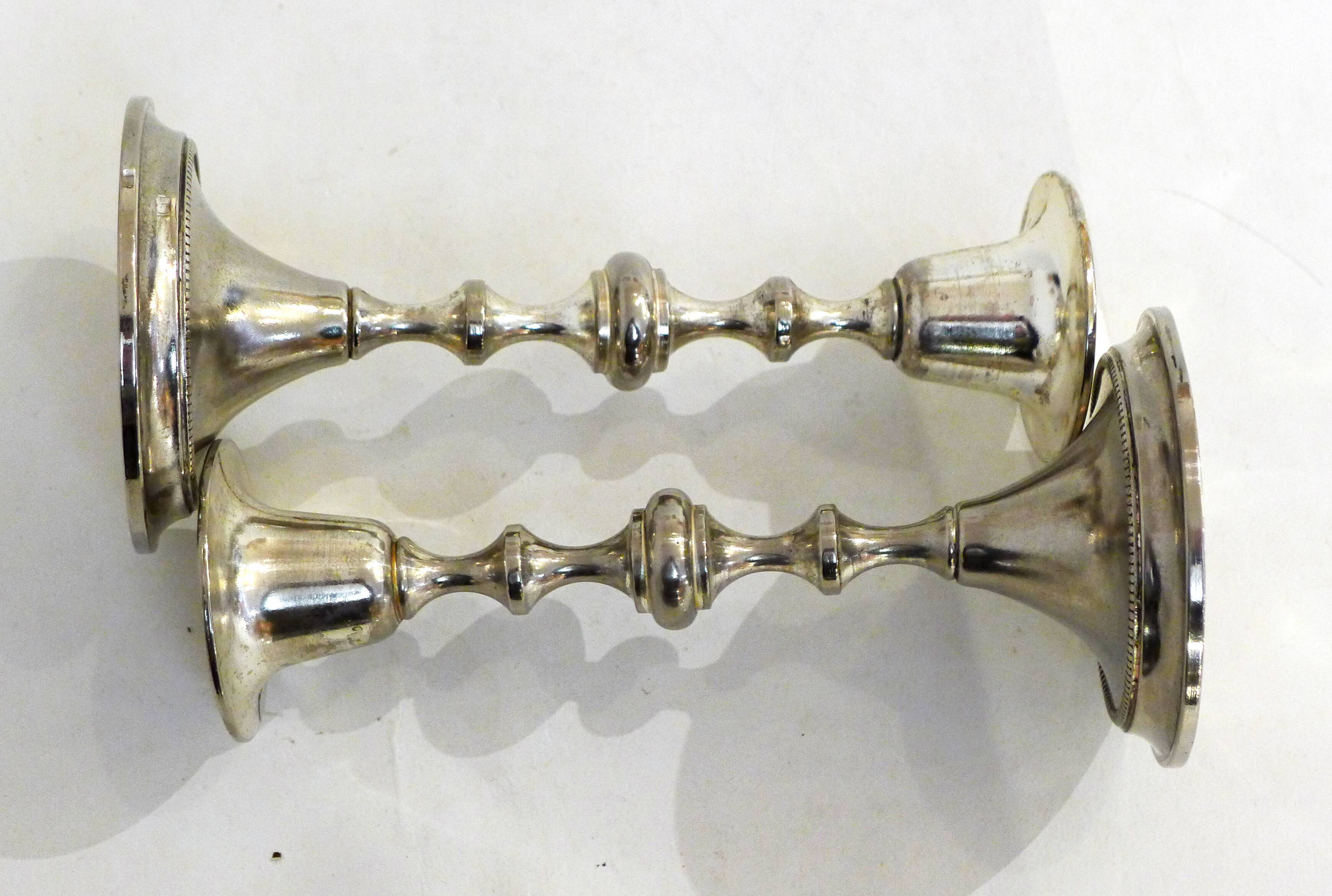 Pair of metal candle holders