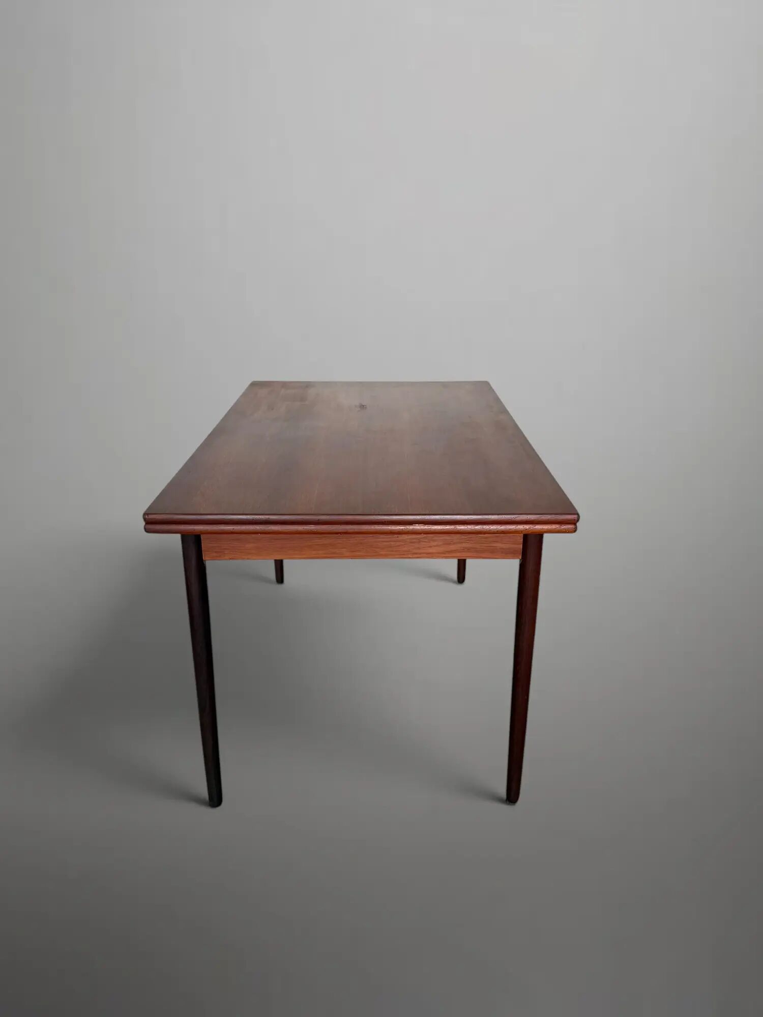 Scandinavian extendable dining table in teak