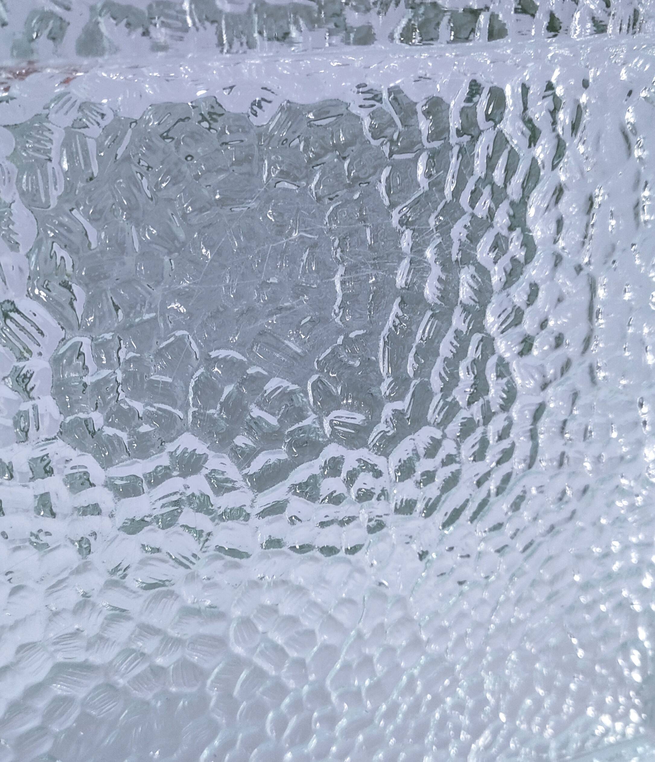 Two designer glass paving pockets