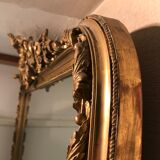 Large antique mirror with flagship shell in wood and gilded stucco