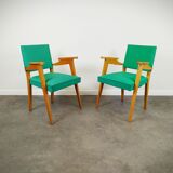 Pair of wood and vinyl armchairs
