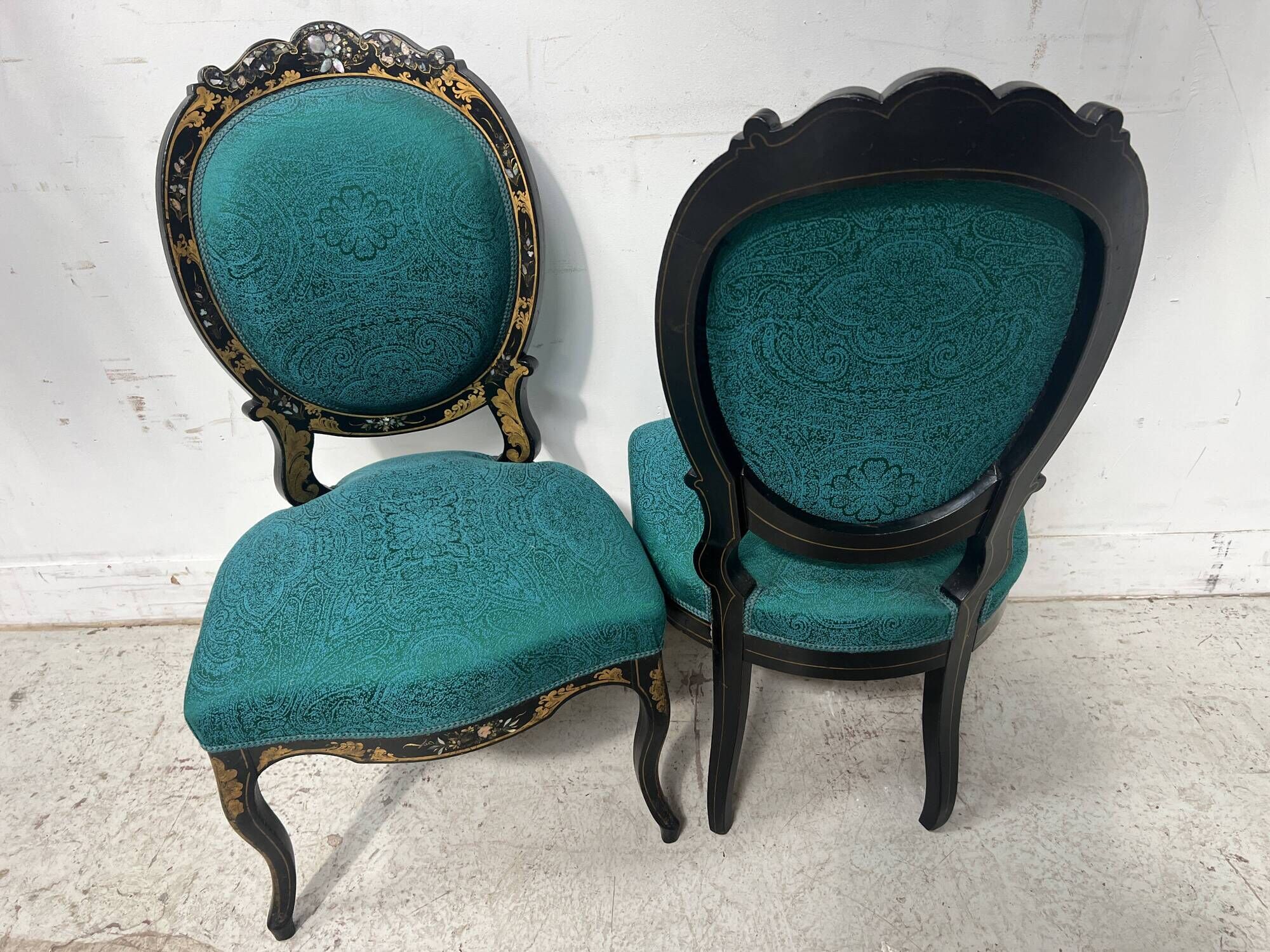 Pair of Napoleon III chairs in black lacquered wood, 19th century.