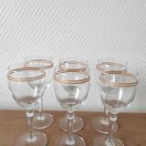 Set of 6 glasses with gold band decorations.