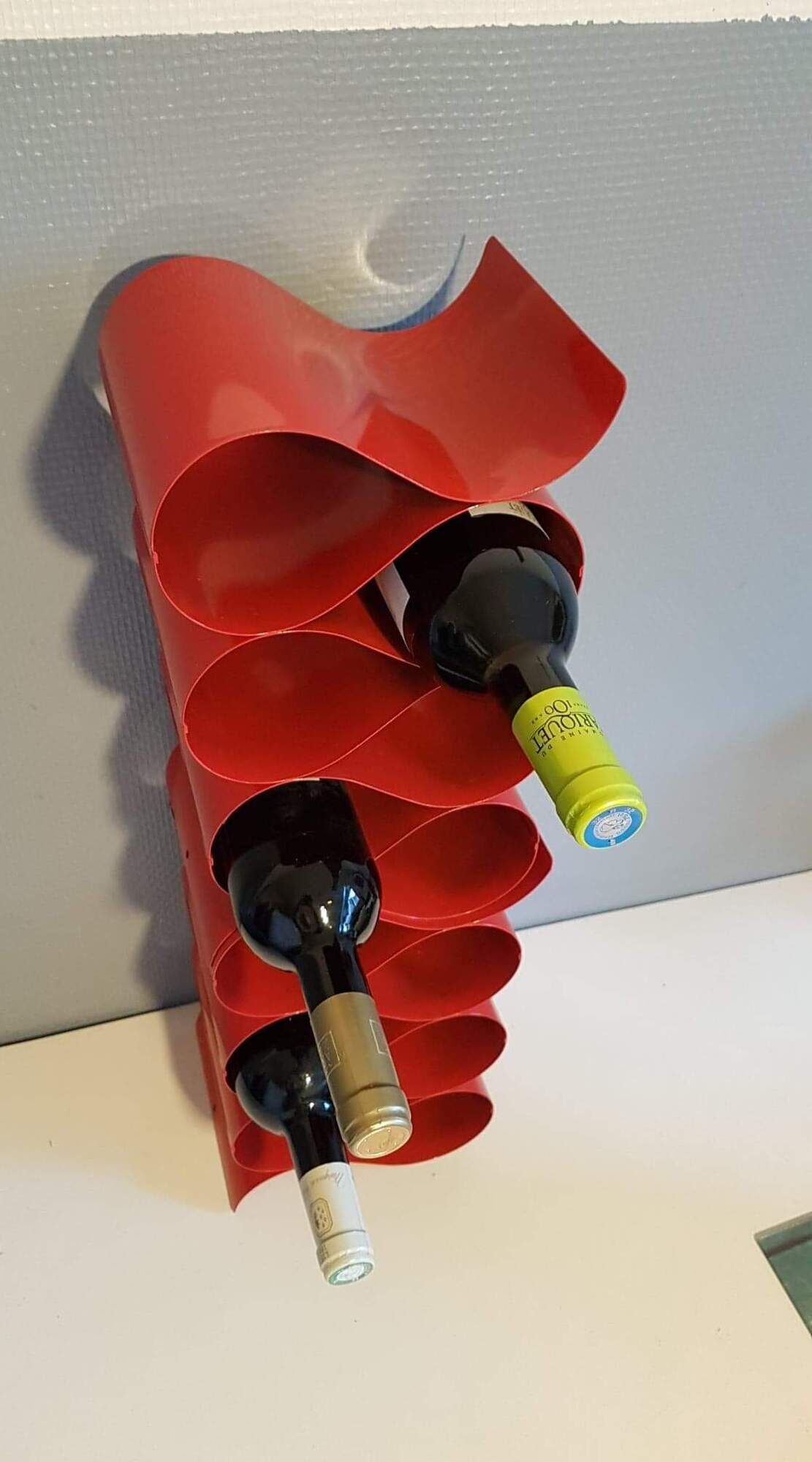 Pair of red metal bottle holders from the 80s