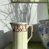 Porcelain pitcher with floral motifs