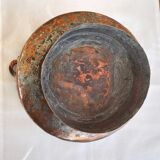 Red copper pot cover on piedouche