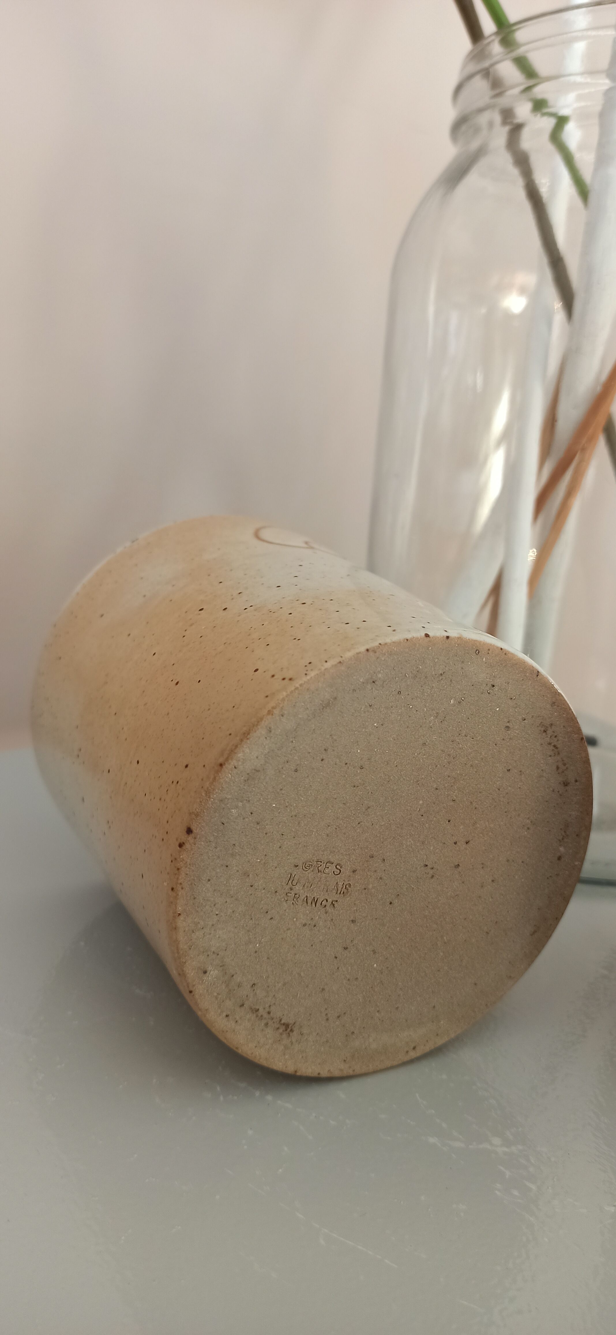 Coffee pot and mug cup in sandstone