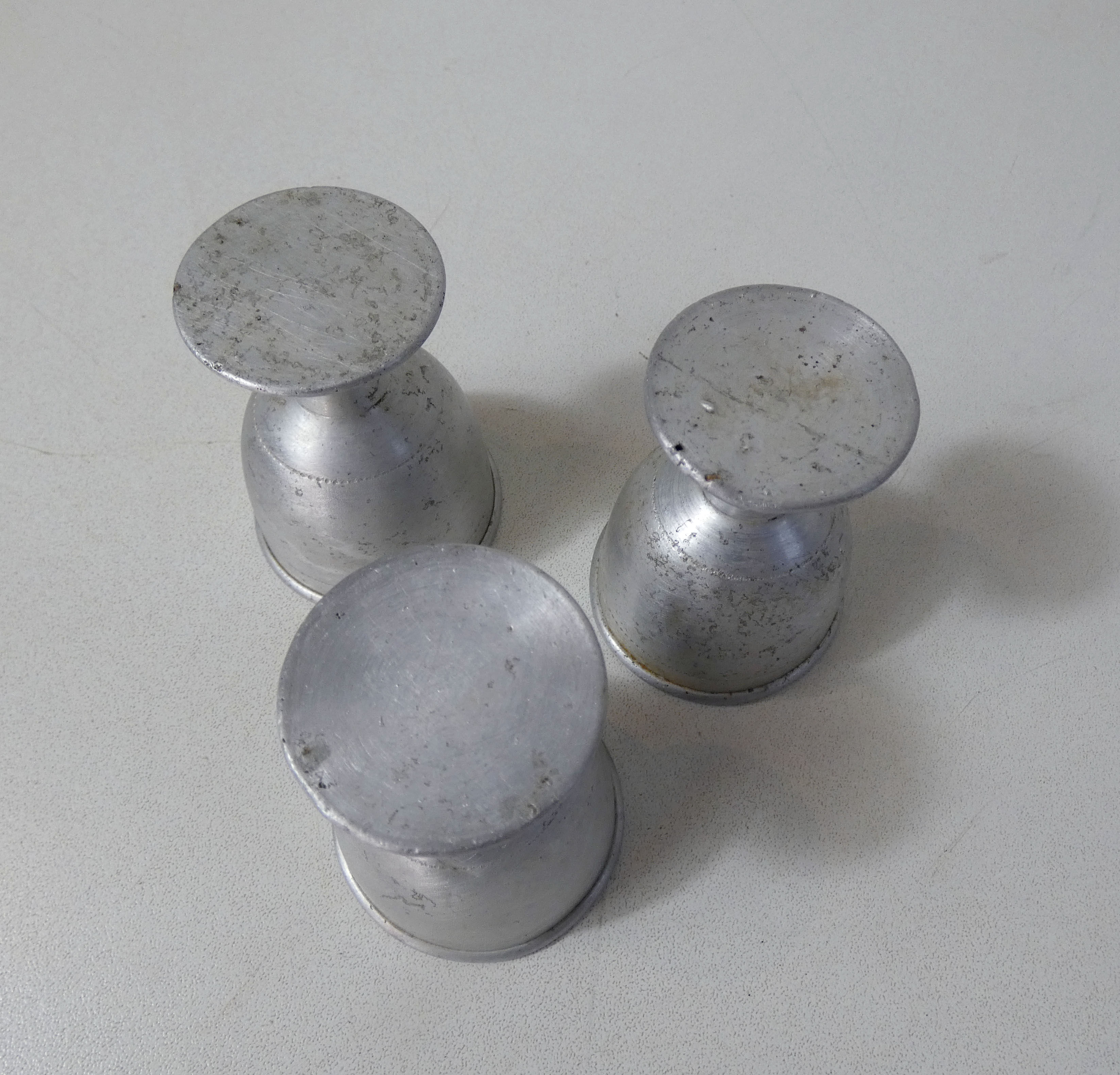 3 old aluminum shells