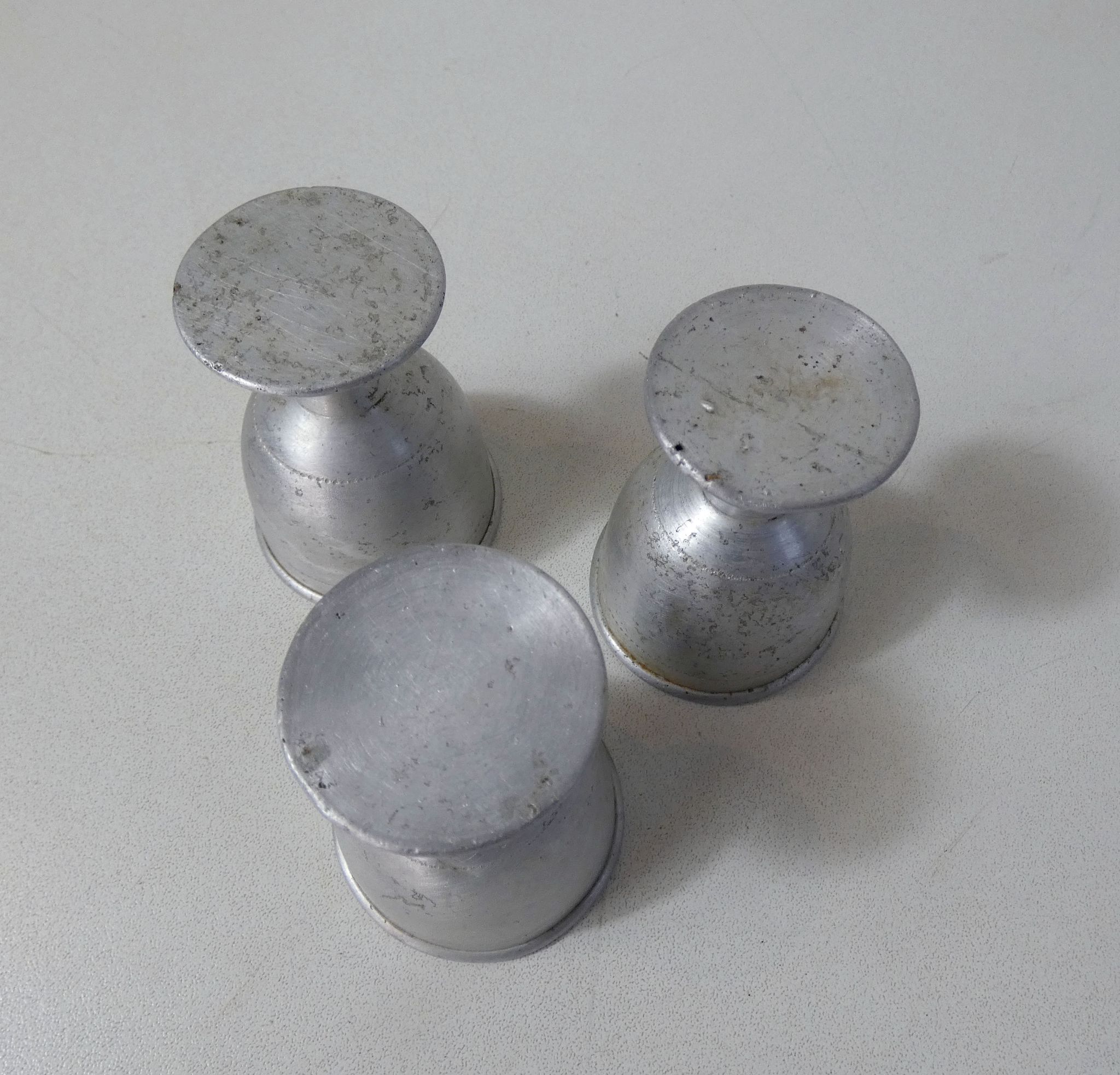 3 old aluminum shells