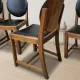 Set of four vintage wooden dining chairs with black leather upholstery, 85 × 45 × 45 cm