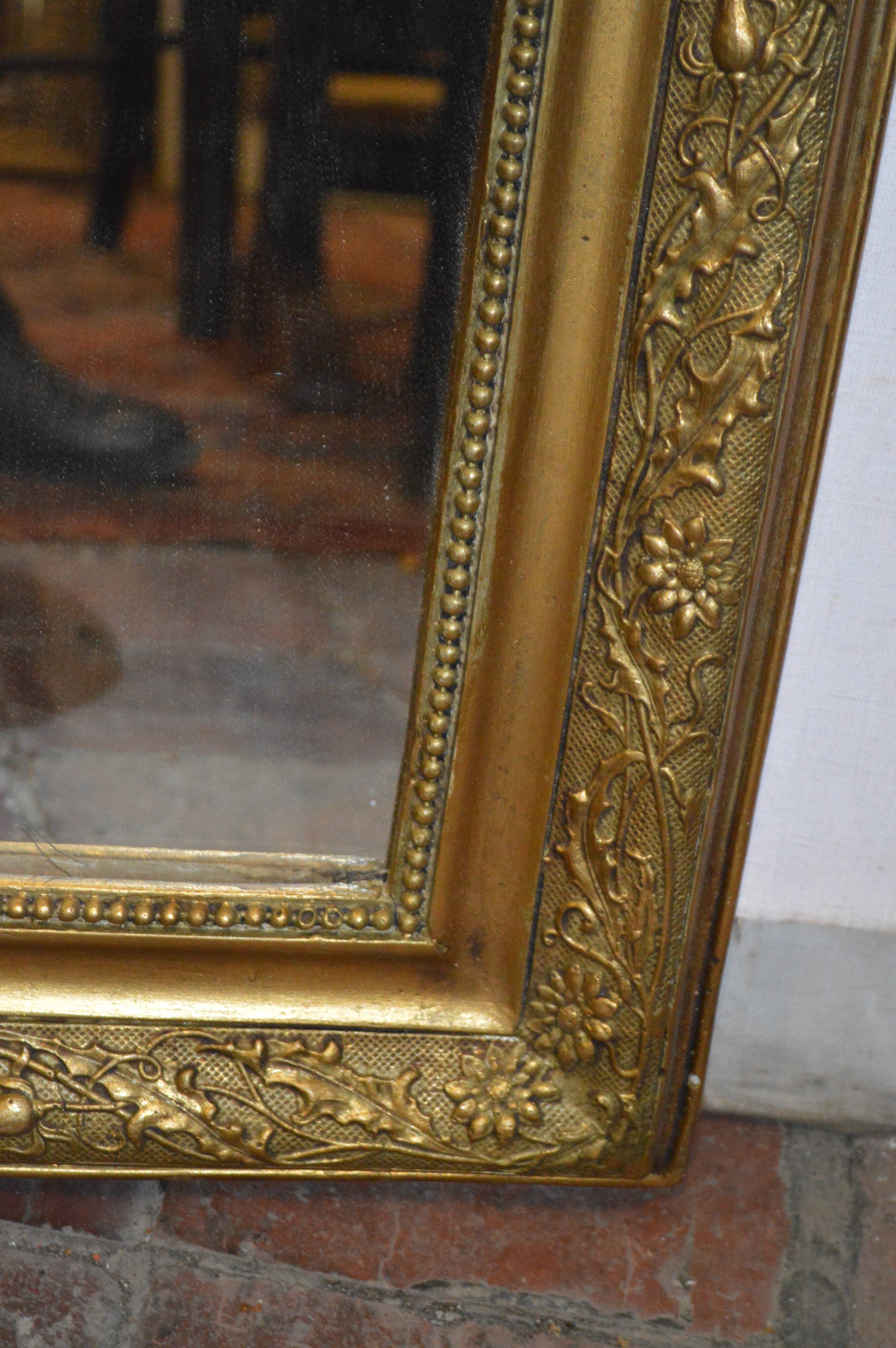 Mirror gilded with musical instruments 75x116cm