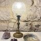 Antique brass foot lamp with glass globe and diamond point.