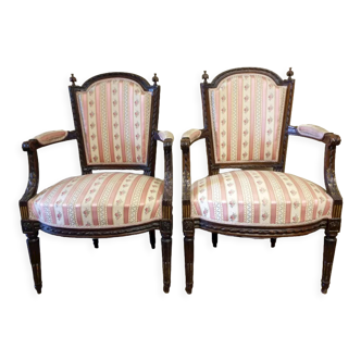 Pair of wooden gendarme's hat armchairs from the Louis XVI period, circa 1780
