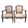 Pair of wooden gendarme's hat armchairs from the Louis XVI period, circa 1780