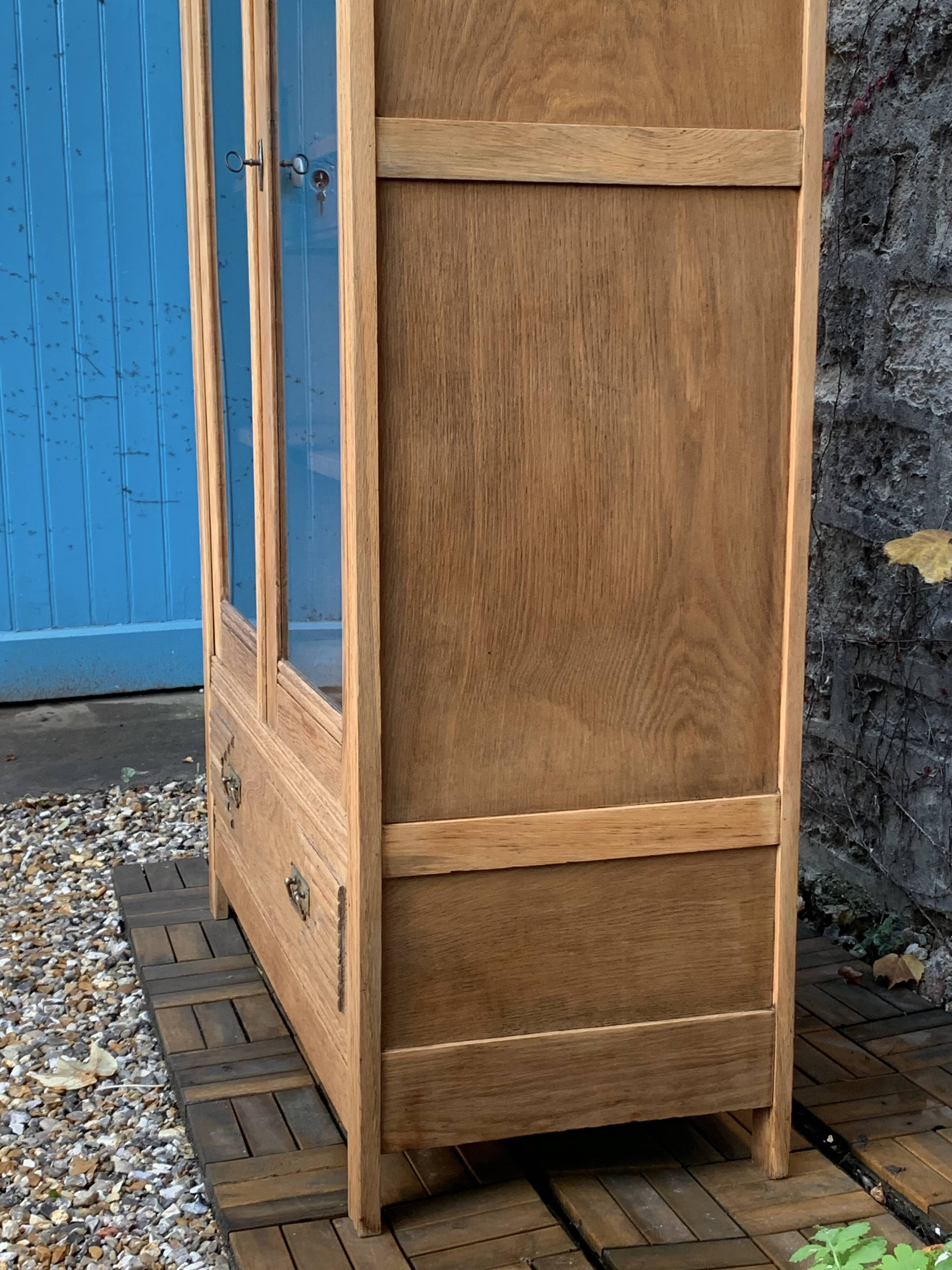 Parisian art deco glass cabinet in raw wood