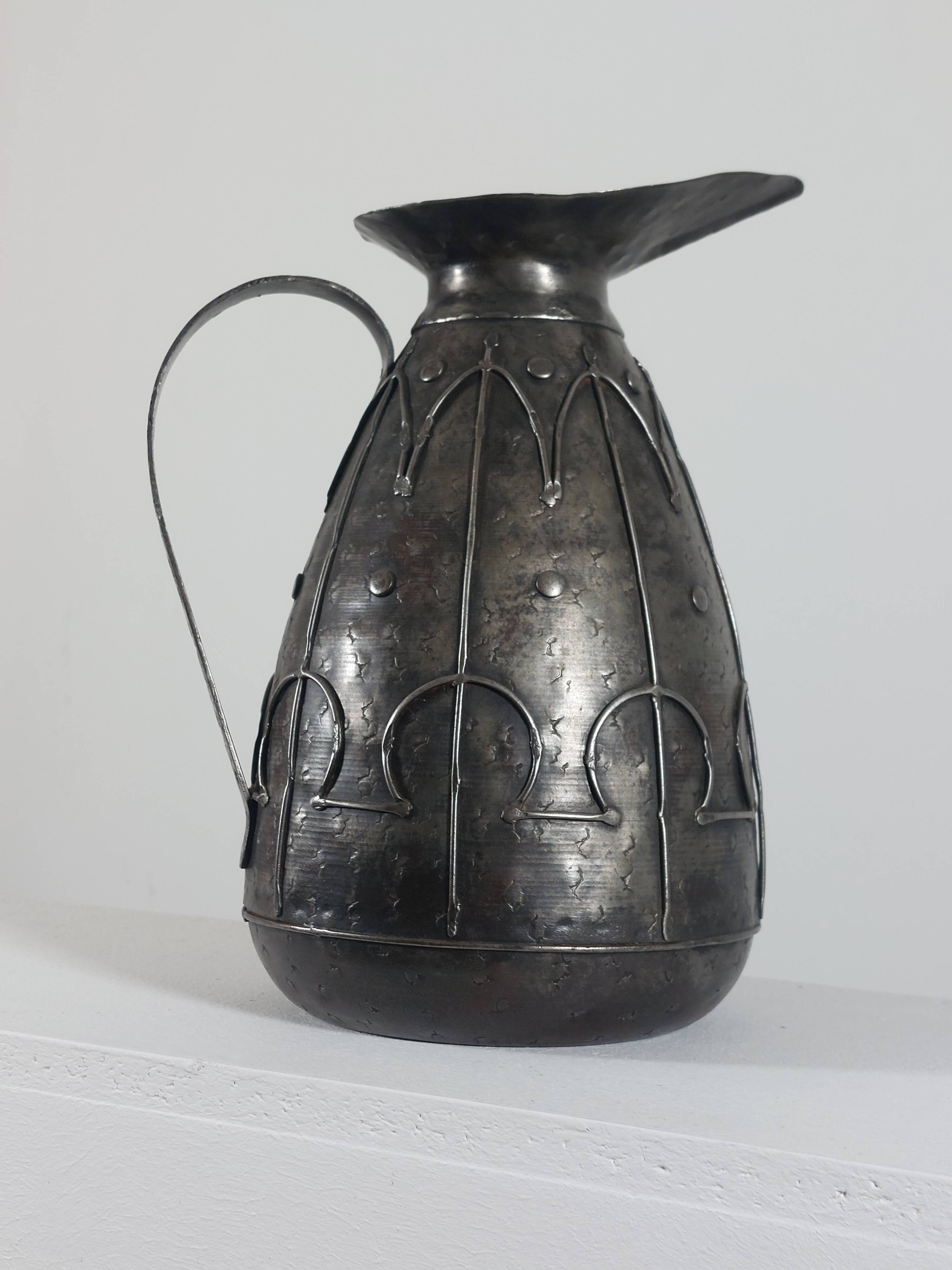 Rare hand-forged metal pitcher and craftsmanship from France.