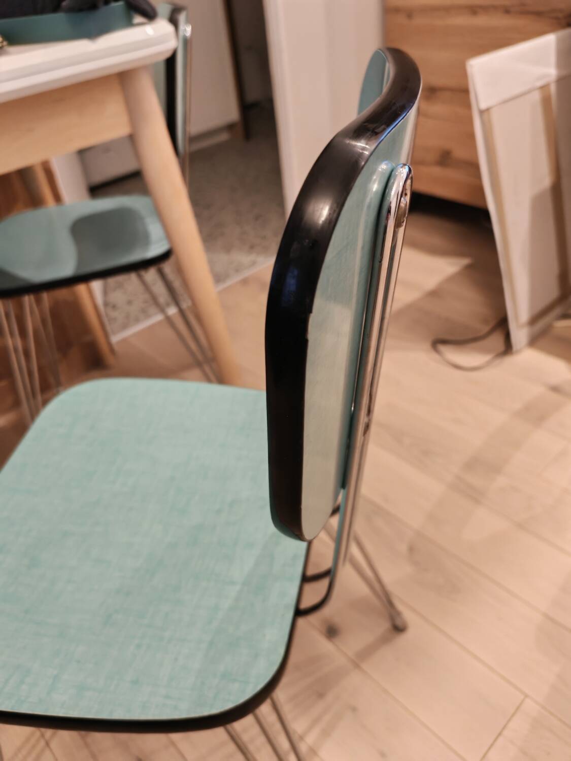 Pair of green Formica chairs with Eiffel legs