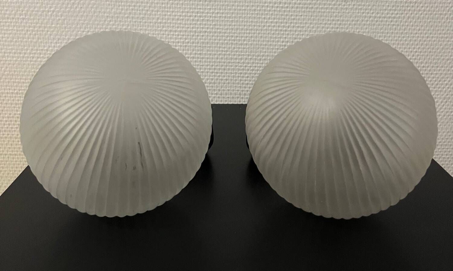 Pair of Inda metal and chiseled glass wall lights